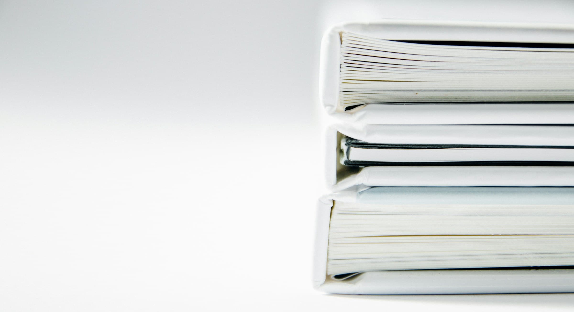 A stack of thick folders