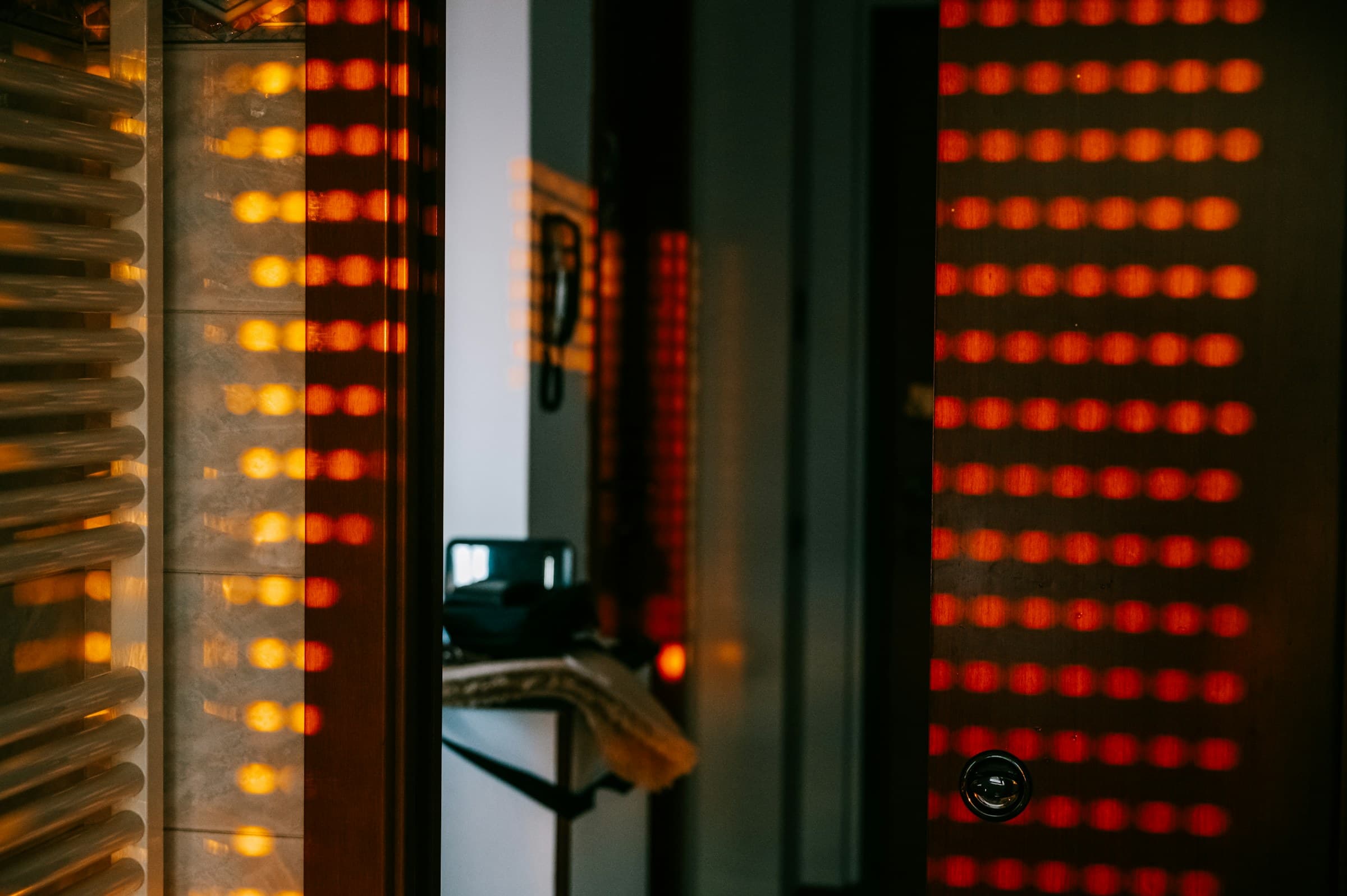 A server rack lit by rows of amber LEDs