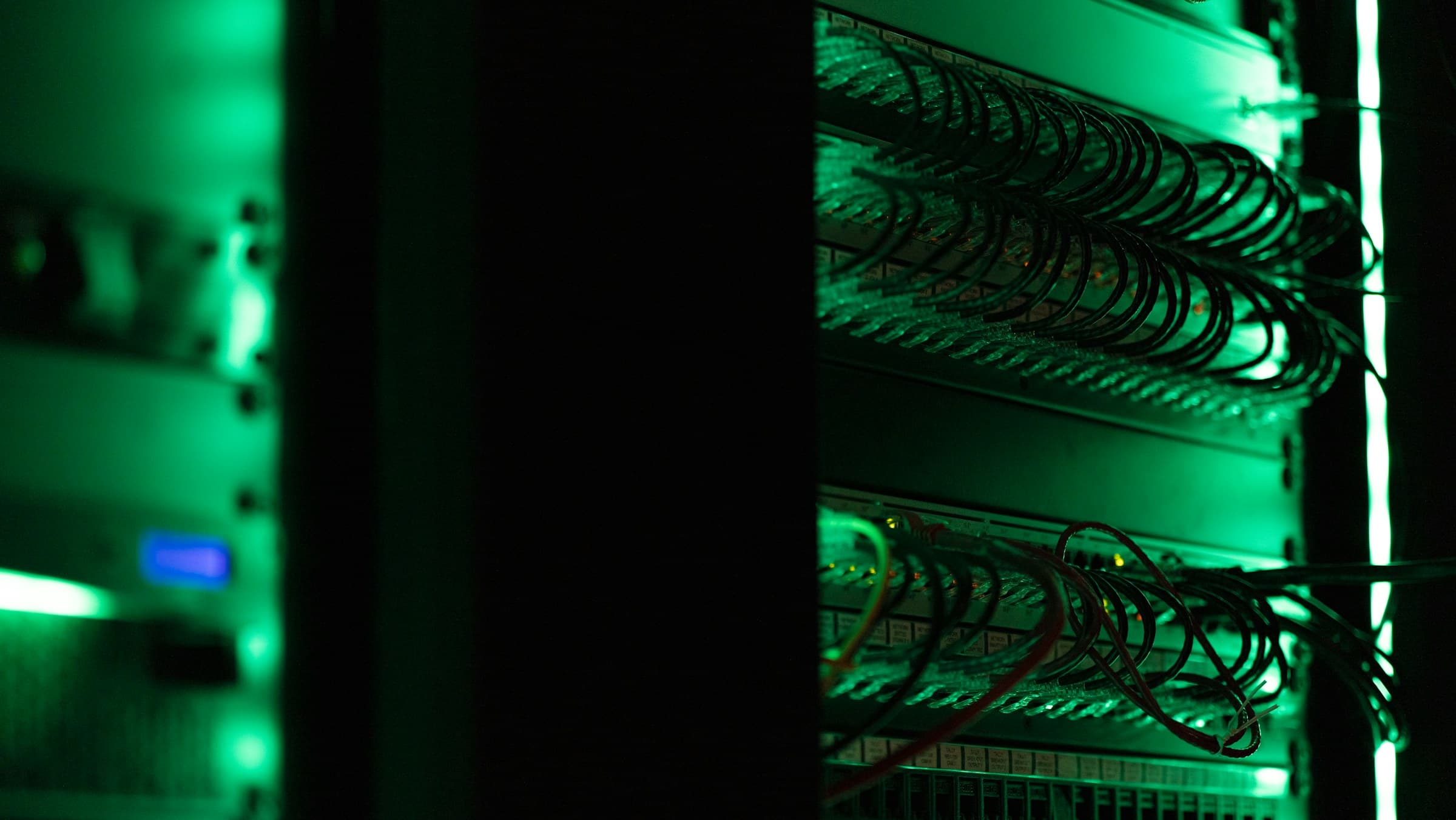 A rack of equipment under green light