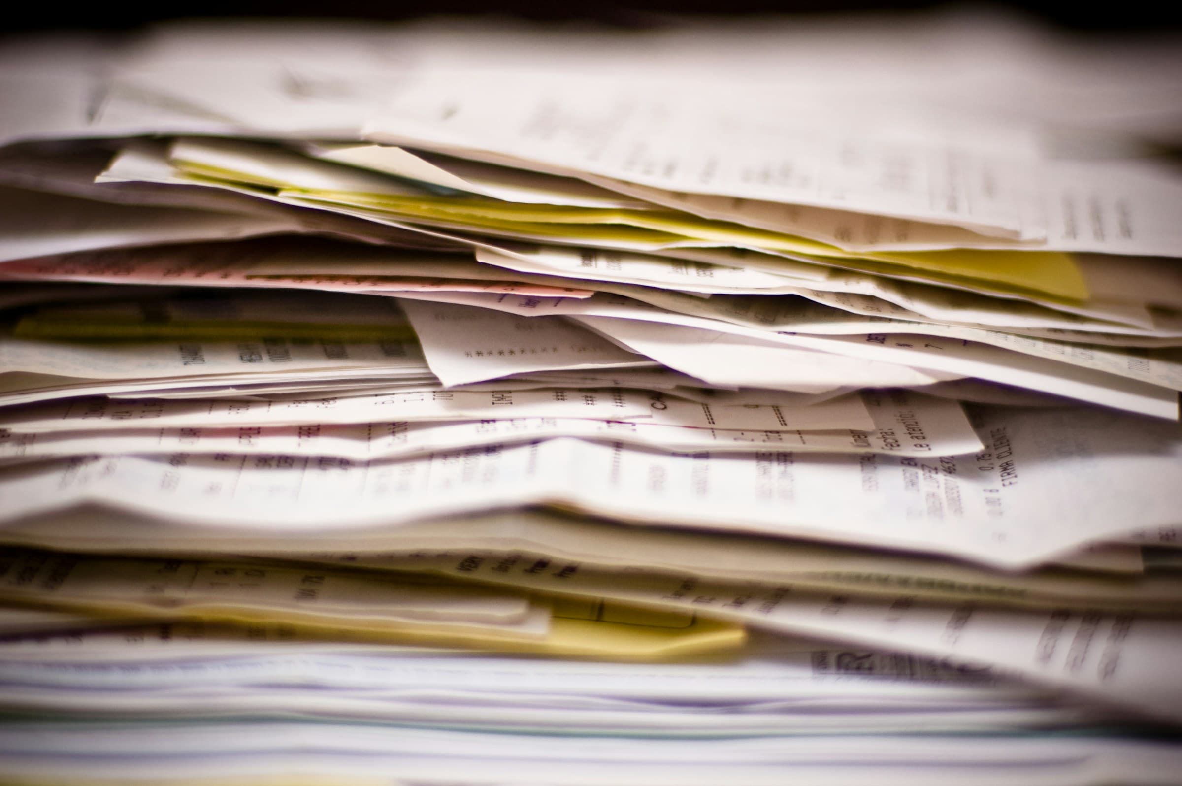 A stack of receipts and invoices