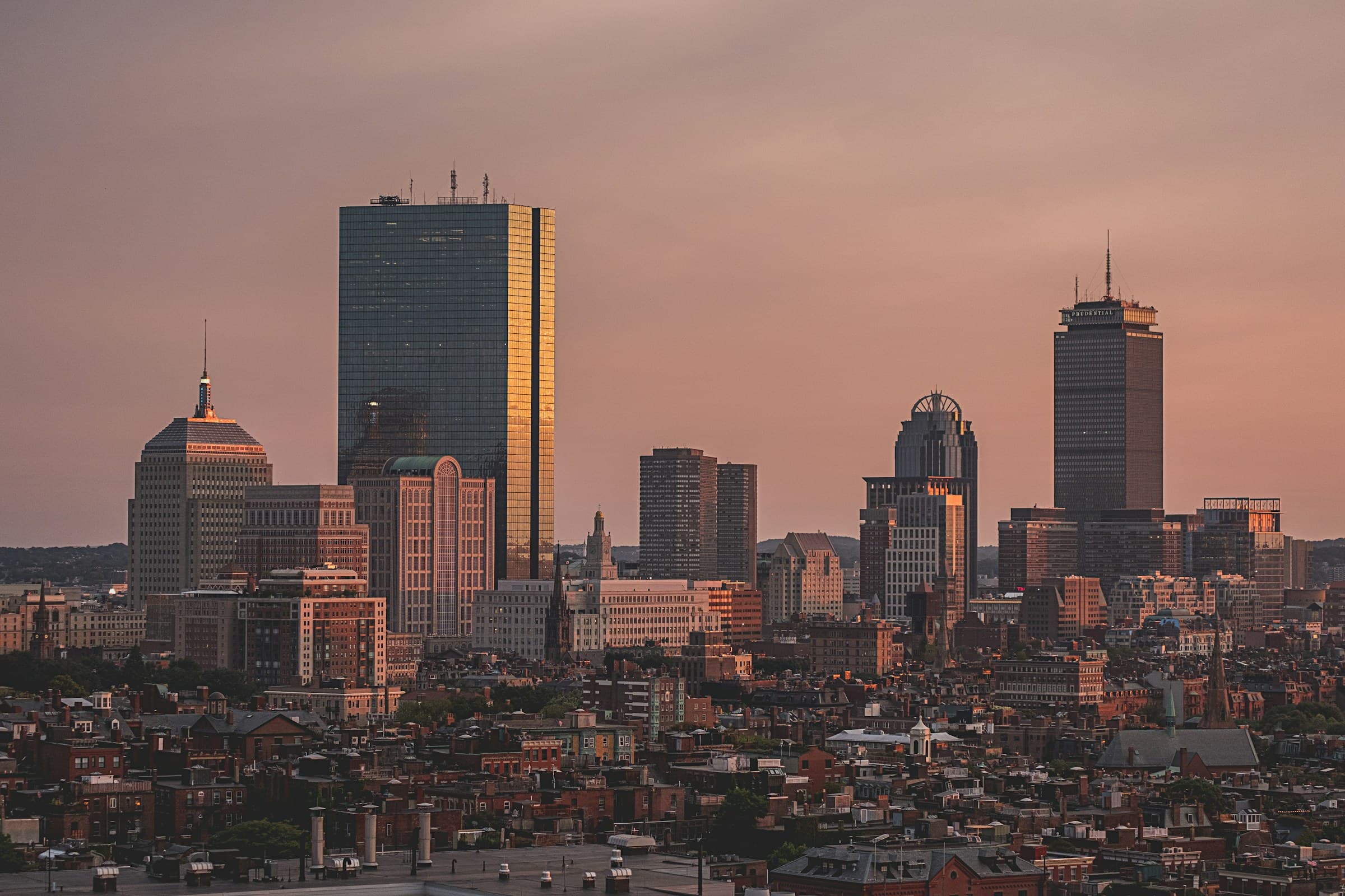 A city skyline in warm dusk light
